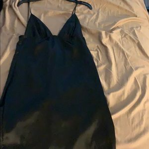 Black low cut dress from Akira.